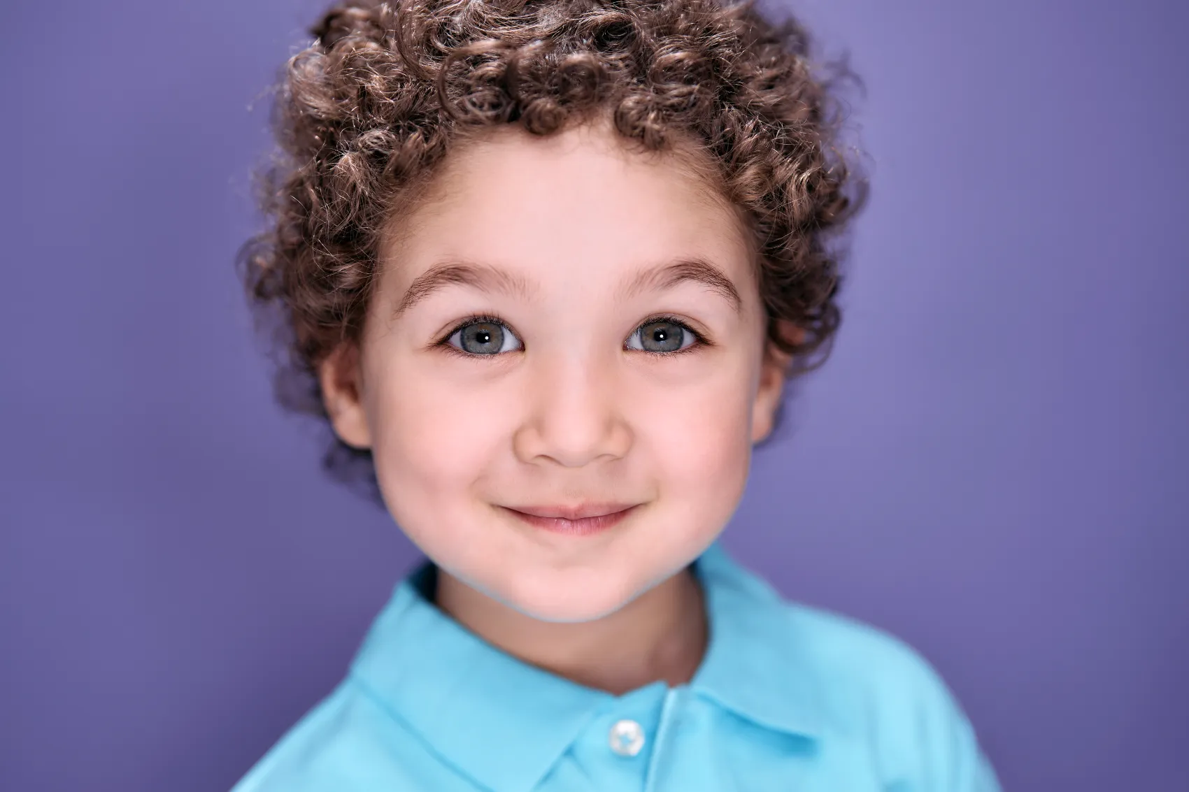 Toddler boy on a bold purple seamless backdrop, ColorPop Kids Los Angeles